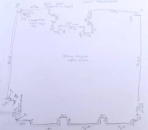 Hand drawn layout of museum space with measurements