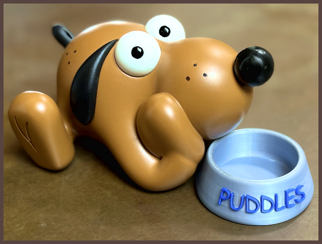 Puddles figurine with his dog dish.