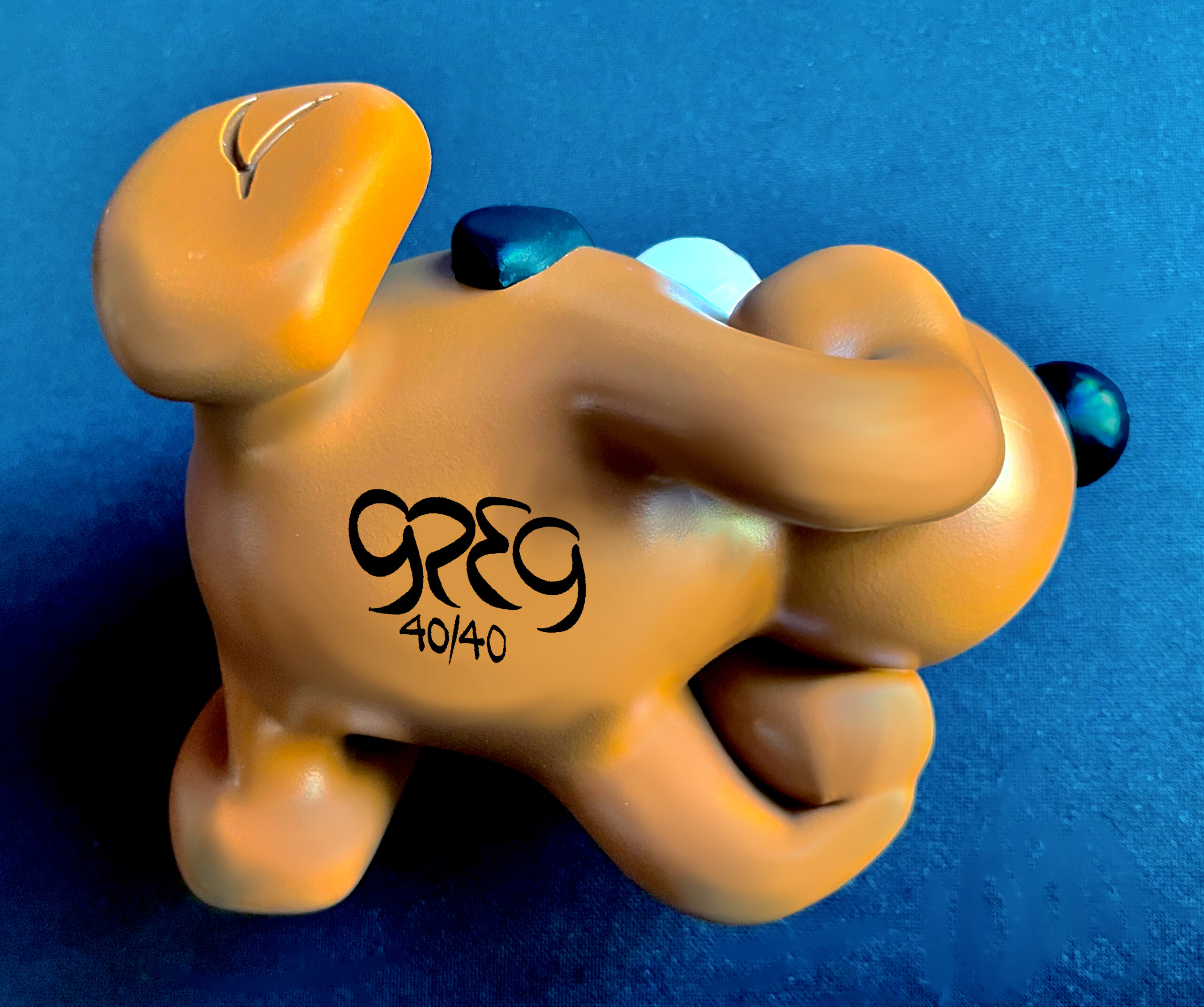 Puddles figurine signed by Greg on the under side.